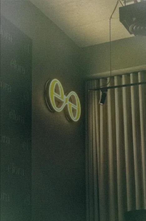 Elora entrance with its illuminated emblem and olive-green interior