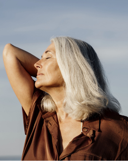 Older woman relaxing in the sunshine