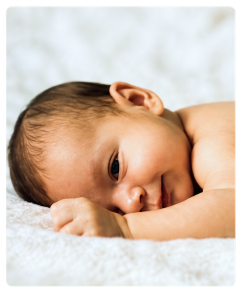 Baby resting on a soft blanket